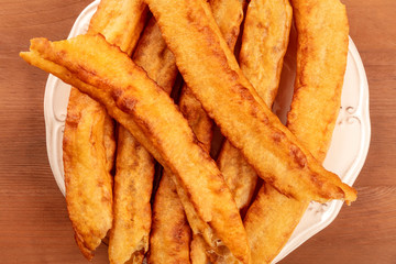 A closeup of traditional Spanish porras, a typical Madrid Sunday breakfast, shot from the top