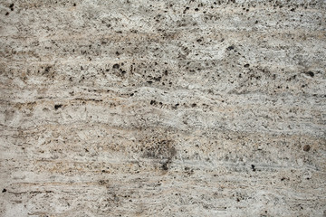 Closeup of beige porous stone textured wall. For background, product designs or ski