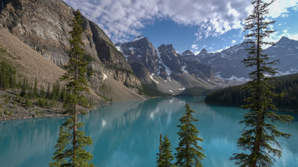 an afternoon shot of the turquoise blue moraine lake at banff national park in canada