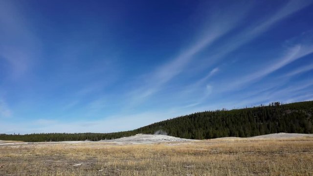 The Geyser Old Faithful at Yellowstone national-park erupting. Shooting water up to 185 feet (56m) it is a spectacular view.