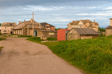 ISLAND SOLOVKI, RUSSIA - JUNE 26, 2018: View of houses in the village of Solovki on a polar summer day, at sunset.  Arkhangelsk region, White Sea