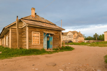 ISLAND SOLOVKI, RUSSIA - JUNE 26, 2018: Barak Solovetsky camp. Now residential house in the village of Solovki on a polar summer day, at sunset.  Arkhangelsk region, White Sea