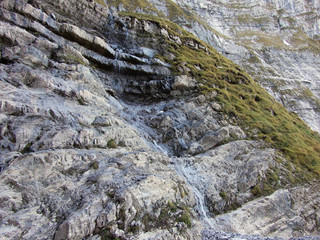 Waterfalls and cascades on the eastern tributary of the Klontalersee lake - Canton of Glarus,...