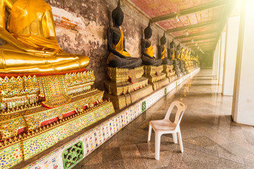 White plastic chair in Wat Suthat Devaravaram temple royal temple at the Giant Swing in Bangkok landmark of Bangkok, Thailand