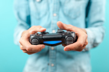 Male hands holding a gaming controller