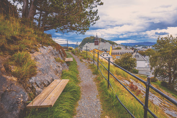 Fototapeta na wymiar Footpath in the park on the mountain. View of the city of Alesund, Norway, Europe