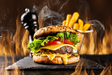 Delicious grilled burgers © George Dolgikh