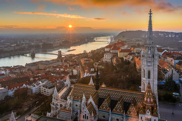 Fototapeta na wymiar Budapest, Hungary - Beautiful aerial sunrise with Matthias Church, Fisherman's Bastion, Szechenyi Chain Bridge and Buda Castle Royal Palace at winter time