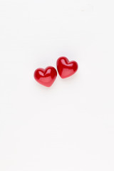 Creative composition for Valentines day with waffle cone, mixed hearts on white background top view. Fashion flat lay.