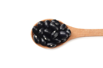 black kidney beans in wooden spoon isolated on white background. top view