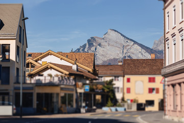 Switzerland, mountain village on the background of alpine mountains, sunny, summer landscape