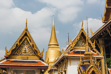 Fototapeta premium The beauty of the Emerald Buddha Temple . And while the gold of the temple catching the light. This is an important buddhist temple of thailand and a famous tourist destination.