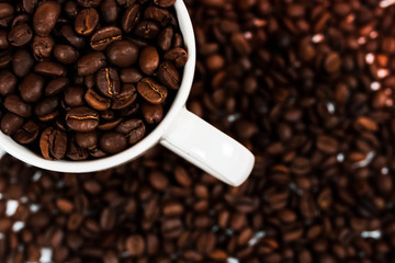white coffee cup and coffee beans. use as background