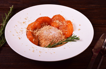 Steamed buns from cottage cheese dough with apricots in bread crumbs and nuts
