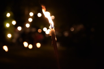 fakel with nice warm flame at night and in the background with a nice bokeh