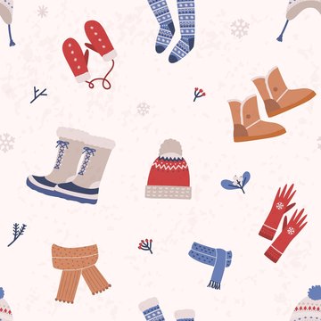 Seamless pattern with knitted apparel and winter boots on light background