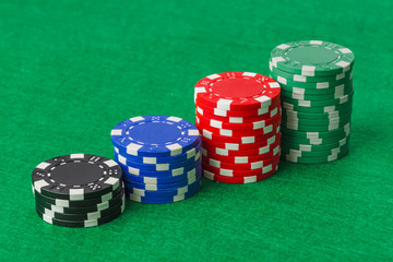 Casino chips on green table