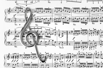 Treble clef on music sheet - musical background