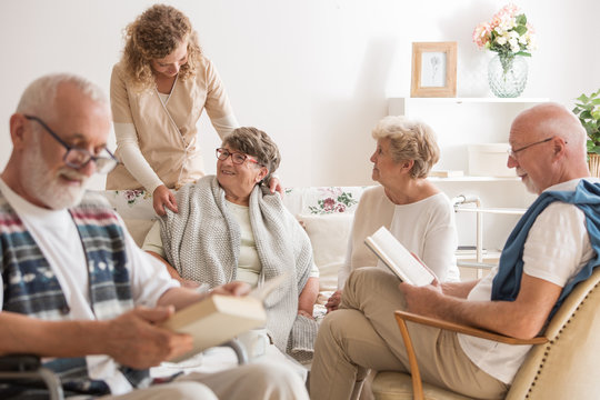 Group of senior friends spending time together at nursing home
