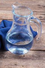 Glasses of water on a wooden table.