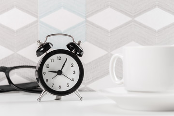 Vintage background with retro alarm clock on table