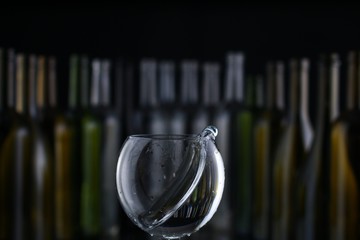 glasses and bottles for brandy and wine in the background