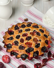 Plum pie on a light background.