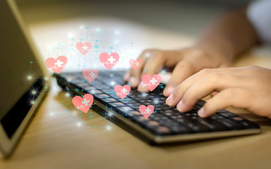 Business people use the keyboard with the view of icons,health care technology/social media concept,health care/valentine concept with health care.