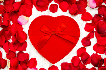 Surprise gift boxes on rose petals, valentines day