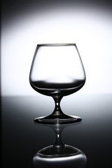 glasses and bottles for brandy and wine in the background