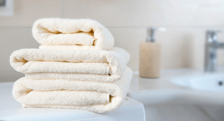 Stack of folded towels empty copy space.