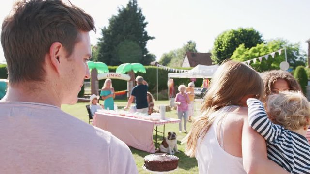 Slow Motion Shot Of Busy Cake Stall At Summer Garden Fete