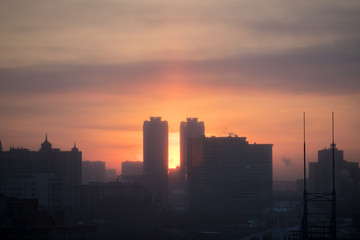 Fototapeta na wymiar Sunrise over modern office buildings in business district center