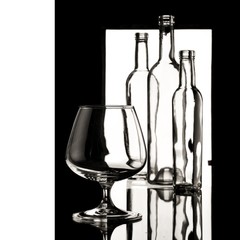 glasses and bottles for brandy and wine in the background