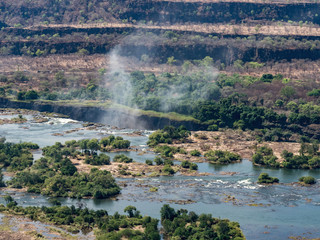 Aerial view of Victorian waterfalls. View from helicopter. The Victoria Falls in Zimbabwe.