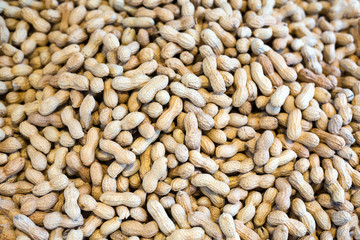Naklejka premium Peanuts in shell texture background. Close up image.