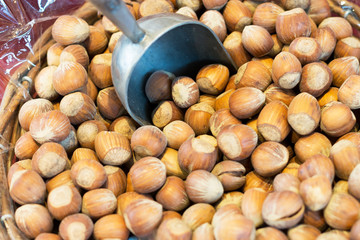 Hazelnuts with scoop, for self-service in the organic market, healthy food.