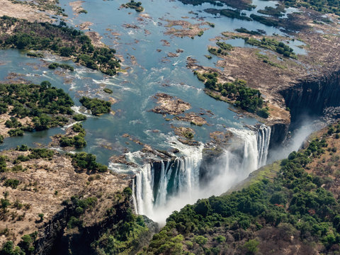 Awesome aerial view of Victorian waterfalls. View from helicopter. The Victoria Falls in Zimbabwe.