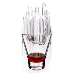 glasses and bottles for brandy and wine in the background