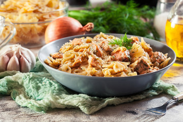 Creamy farfalle pasta with salmon, parmesan cheese and dill