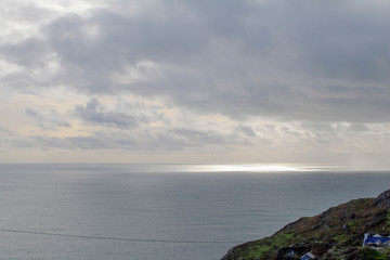 Sunlight peaking through the dark clouds on the West Coast