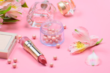 Obraz na płótnie Canvas cosmetics and accessories on a pink background