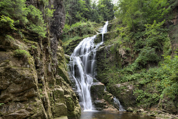 Fototapeta na wymiar Mountain stream and waterfall in Europe.