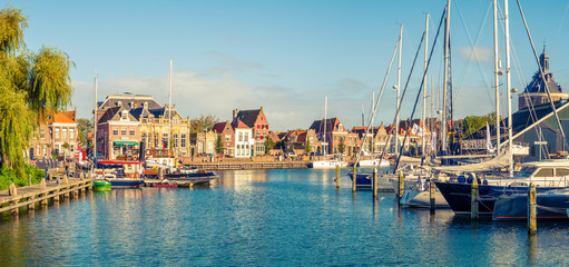 Fototapeta na wymiar Panorama of old harbour and quayside in historic city of Enkhuizen, North Holland, Netherlands