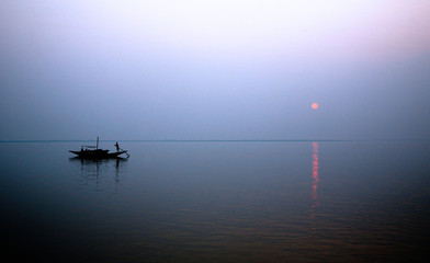 A stunning sunset looking over the holiest of rivers in India. Ganges delta in Sundarbans, West Bengal, India