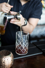 Bartender making cocktails in a restaurant