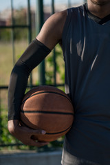 Handsome young afroamerican enjoying basketball