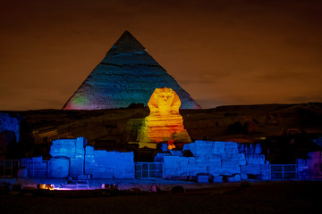 Egypt night at the Pyramids with the Sphinx iluminated in Giza Plateau Cairo