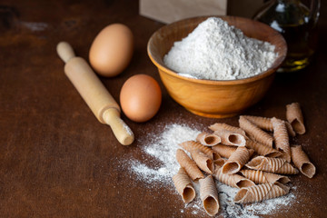 Fototapeta na wymiar Italian handmade garganelli pasta from spelt flour