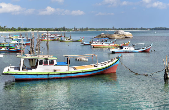 Traditional fishing boats in Pantai Batu Banyak Beach, Belitung Island, Indonesia